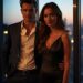 Attractive man and woman in stylish clothes with city skyline at sunset, representing the halo effect in psychology.